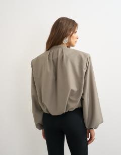 Model wearing Oversized zip up bomber jacket in stone