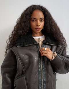 Model wearing Ovoid shearling jacket in brown