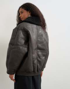 Model wearing Ovoid shearling jacket in brown