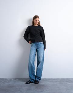 Model wearing Ovoid sleeve blazer top in black