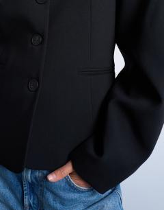 Model wearing Ovoid sleeve blazer top in black