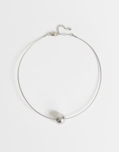 Model wearing Ozzie waterproof stainless steel necklace in silver brushed