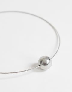 Model wearing Ozzie waterproof stainless steel necklace in silver brushed