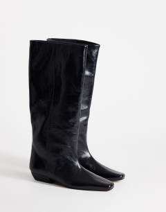 Model wearing Pablo real leather pull on western boot in black