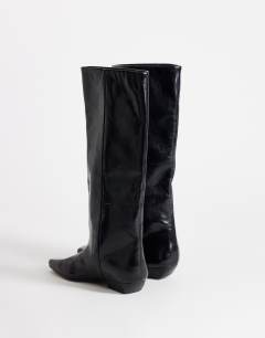 Model wearing Pablo real leather pull on western boot in black