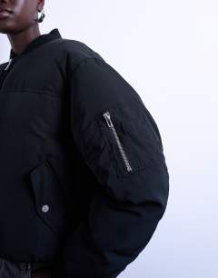 Model wearing Padded hybrid bomber jacket in black
