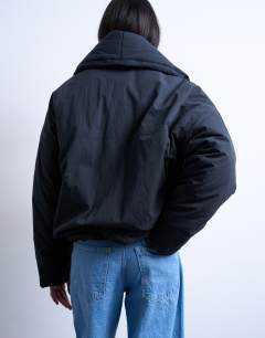 Model wearing Padded shawl puffer jacket in washed black