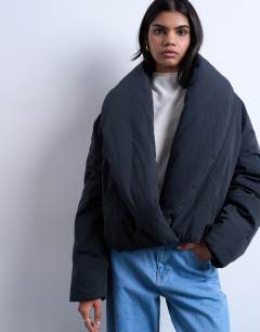 Model wearing Padded shawl puffer jacket in washed black