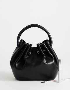 Model wearing Paige medium ring handle grab bag in black