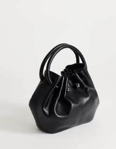 Model wearing Paige medium ring handle grab bag in black