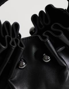 Model wearing Paige ring handle grab bag in  black