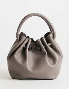 Model wearing Paige ring handle grab bag in grey