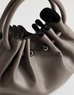 Model wearing Paige ring handle grab bag in grey