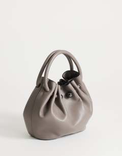 Model wearing Paige ring handle grab bag in grey