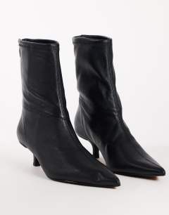 Model wearing Palmer real leather kitten heel ankle boot in black