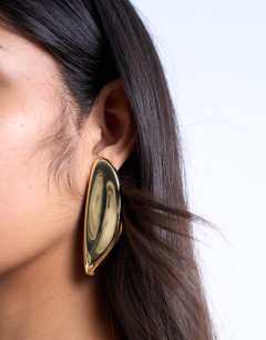 Model wearing Paloma statement earring in gold