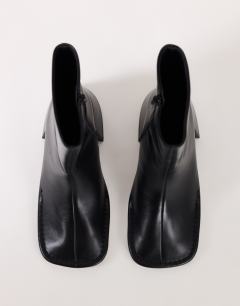 Model wearing Pamela real leather block heel ankle boot in black