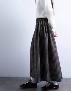 Model wearing Paper bag full circle maxi skirt in brown stripe