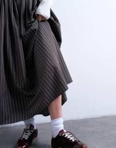 Model wearing Paper bag full circle maxi skirt in brown stripe