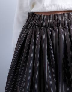Model wearing Paper bag full circle maxi skirt in brown stripe