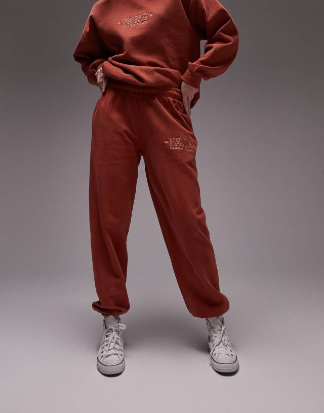 Topshop paris embroidered vintage wash oversized cuffed jogger in orange - part of a set