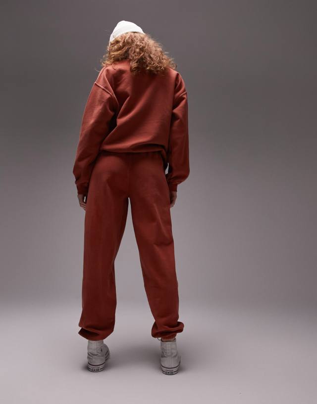 Topshop paris embroidered vintage wash oversized cuffed jogger in orange - part of a set 0
