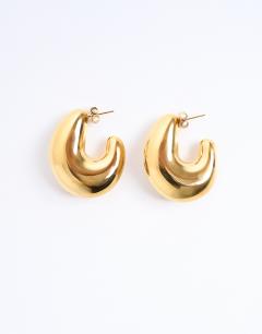 Model wearing Paris waterproof stainless steel hoop earrings in gold
