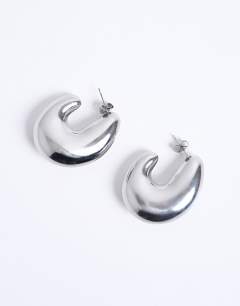 Model wearing Paris waterproof stainless steel hoop earrings in silver