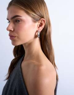 Model wearing Paris waterproof stainless steel hoop earrings in silver