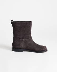 Model wearing Pascal  real leather suede ankle boot in chocolate