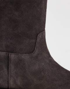 Model wearing Pascal  real leather suede ankle boot in chocolate