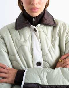 Model wearing Patchwork quilted liner jacket in chocolate