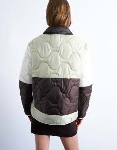 Model wearing Patchwork quilted liner jacket in chocolate