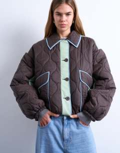 Patchwork quilted shacket with contrast piping in blue
