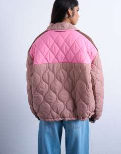 Model wearing Patchwork quilted shacket with contrast piping in pink