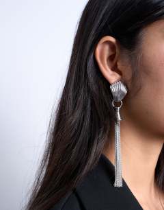 Model wearing Paulo tassel earrings in silver