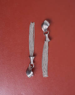 Model wearing Paulo tassel earrings in silver