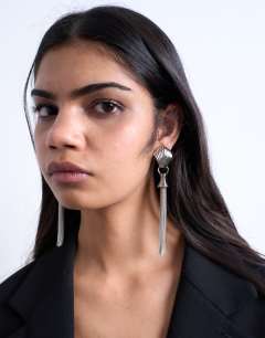 Model wearing Paulo tassel earrings in silver