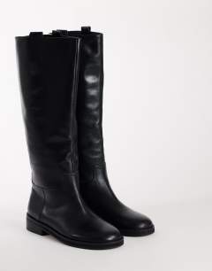 Model wearing Penelope real leather riding boot in black