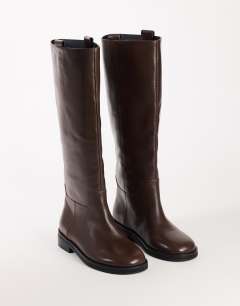 Model wearing Penelope real leather riding boot in chocolate