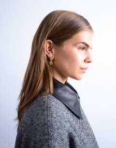 Model wearing Penn waterproof stainless steel mini drop stud earring in gold