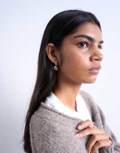 Model wearing Penn waterproof stainless steel mini drop stud earring in silver