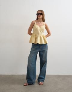 Model wearing Peplum stitch detail cami in buttermilk