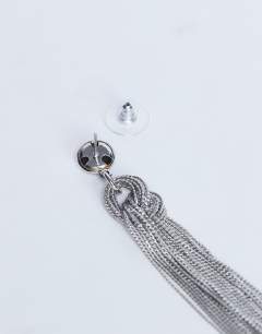 Model wearing Perl tassel earrings in silver