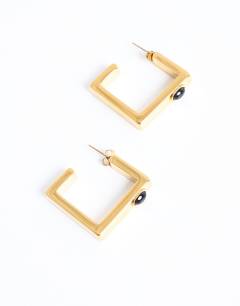 Model wearing Perry waterproof stainless steel square hoop earring in gold & black stone