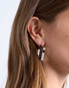 Model wearing Perry waterproof stainless steel square hoop earring in silver & black stone