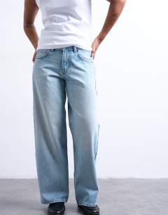 Model wearing Cinch low rise relaxed jean in bleach