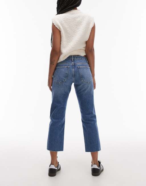 Topshop Petite cropped mid rise straight jeans with raw hems in mid blue ASOS