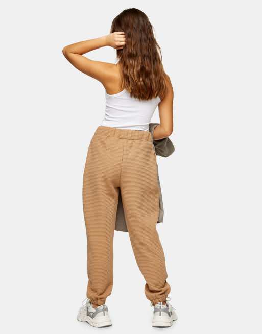 Topshop Petite diamond quilted jogger in camel ASOS