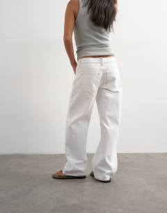 Model wearing Petite Ember low rise straight jean in white